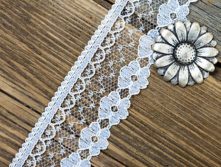 Image showing vintage button and lace tape