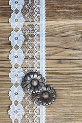 Image showing vintage button and lace tape