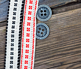 Image showing two vintage tape with embroidered ornaments and old buttons