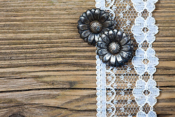 Image showing vintage metal buttons flowers and lace tape