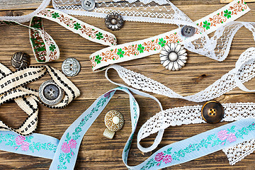 Image showing vintage buttons, lace, tape and ribbons