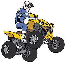 Image showing Rider on the yellow ATV
