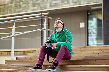 Image showing young hipster man with digital camera in city