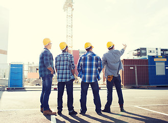 Image showing group of builders in hardhats outdoors