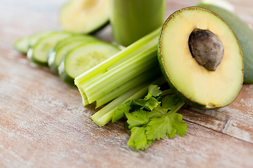 Image showing close up of fresh green juice glass and vegetables