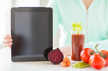 Image showing close up of woman with tablet pc and vegetables