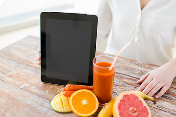 Image showing close up of woman hands with juice and fruits