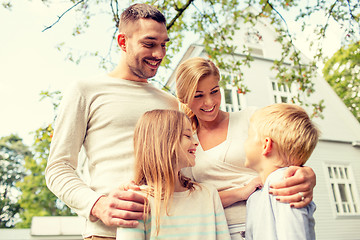 Image showing happy family in front of house outdoors