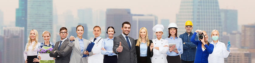 Image showing happy businessman over professional workers