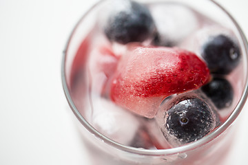 Image showing close up of fruit water with ice cubes in glass