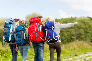 Image showing group of friends with backpacks hiking