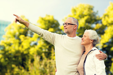 Image showing senior couple hugging in park