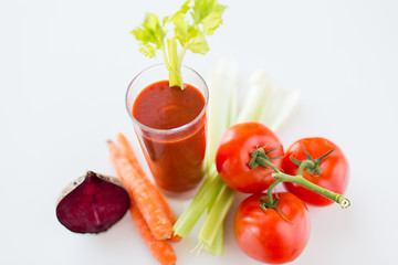 Image showing close up of fresh juice and vegetables on table