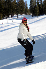 Image showing Girl snowboarding