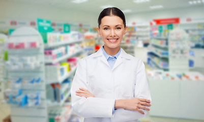 Image showing young woman pharmacist drugstore or pharmacy