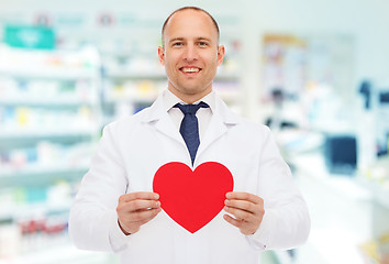 Image showing male pharmacist with heart at drugstore