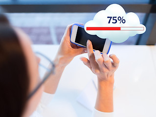 Image showing close up of woman with smartphone cloud computing