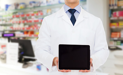 Image showing male doctor with tablet pc at drugstore