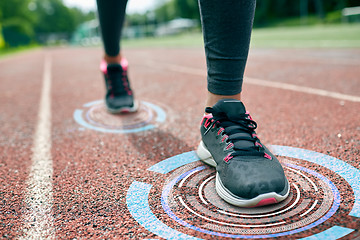 Image showing close up of woman feet running on track