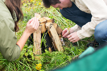 Image showing close up of hikers kindling fire