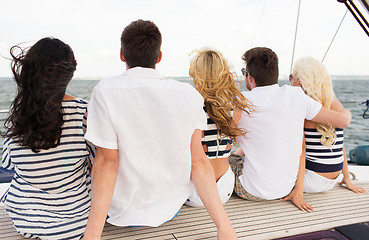 Image showing group of friends sitting on yacht deck