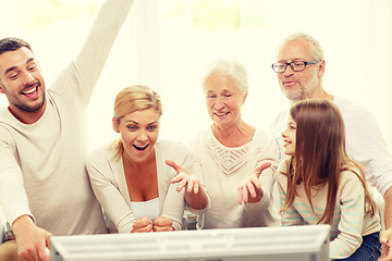 Image showing happy family watching tv at home