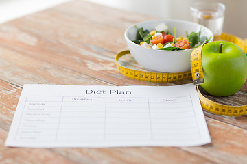 Image showing close up of diet plan and food on table