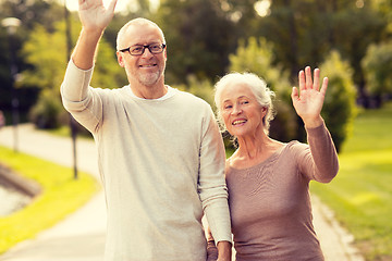 Image showing senior couple hugging in city park