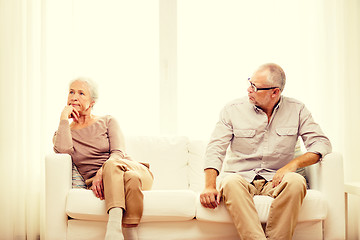 Image showing senior couple sitting on sofa at home