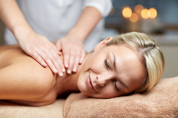 Image showing close up of woman lying and having massage in spa