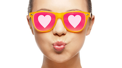 Image showing girl in pink sunglasses blowing kiss