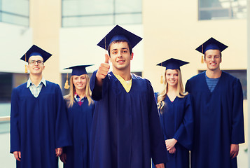 Image showing group of smiling students in mortarboards