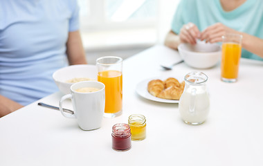 Image showing close up of couple having breakfast at home