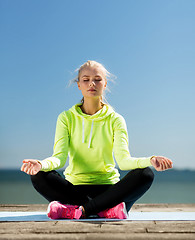 Image showing woman doing yoga outdoors