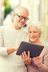 Image showing senior couple photographing on city street