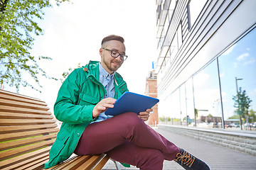 Image showing happy young hipster man with tablet pc and bike