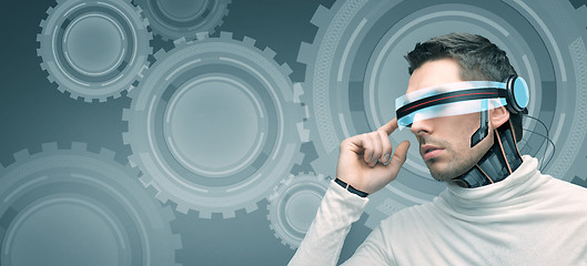 Image showing man with futuristic 3d glasses and sensors