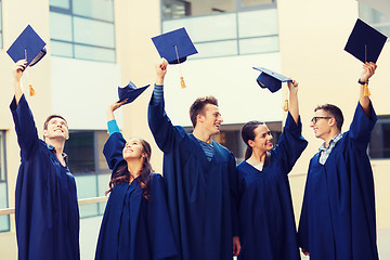 Image showing group of smiling students in mortarboards