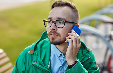 Image showing young hipster man calling on smartphone