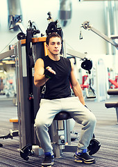 Image showing man exercising on gym machine