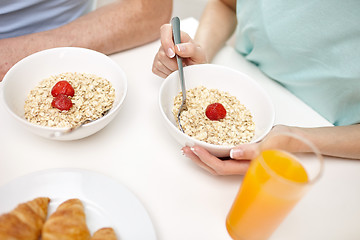 Image showing close up of couple having breakfast at home