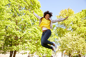 Image showing happy african american young woman in summer park