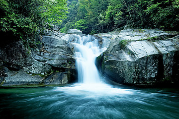 Image showing Large rain forest waterfall