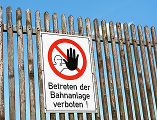 Image showing German safety sign - keep off the railway