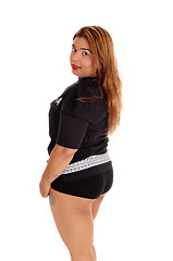 Image showing Girl in sports clothing from back.