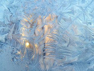 Image showing Ice pattern and sunlight on winter glass