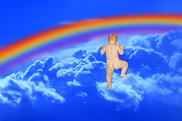 Image showing baby climbs to the blue heaven with rainbow