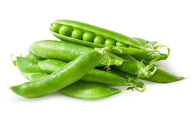 Image showing Pile closed pea pods and one open