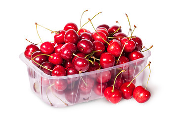 Image showing Sweet cherries in plastic tray and three near top view