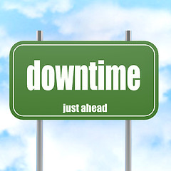 Image showing Green road sign with downtime word 